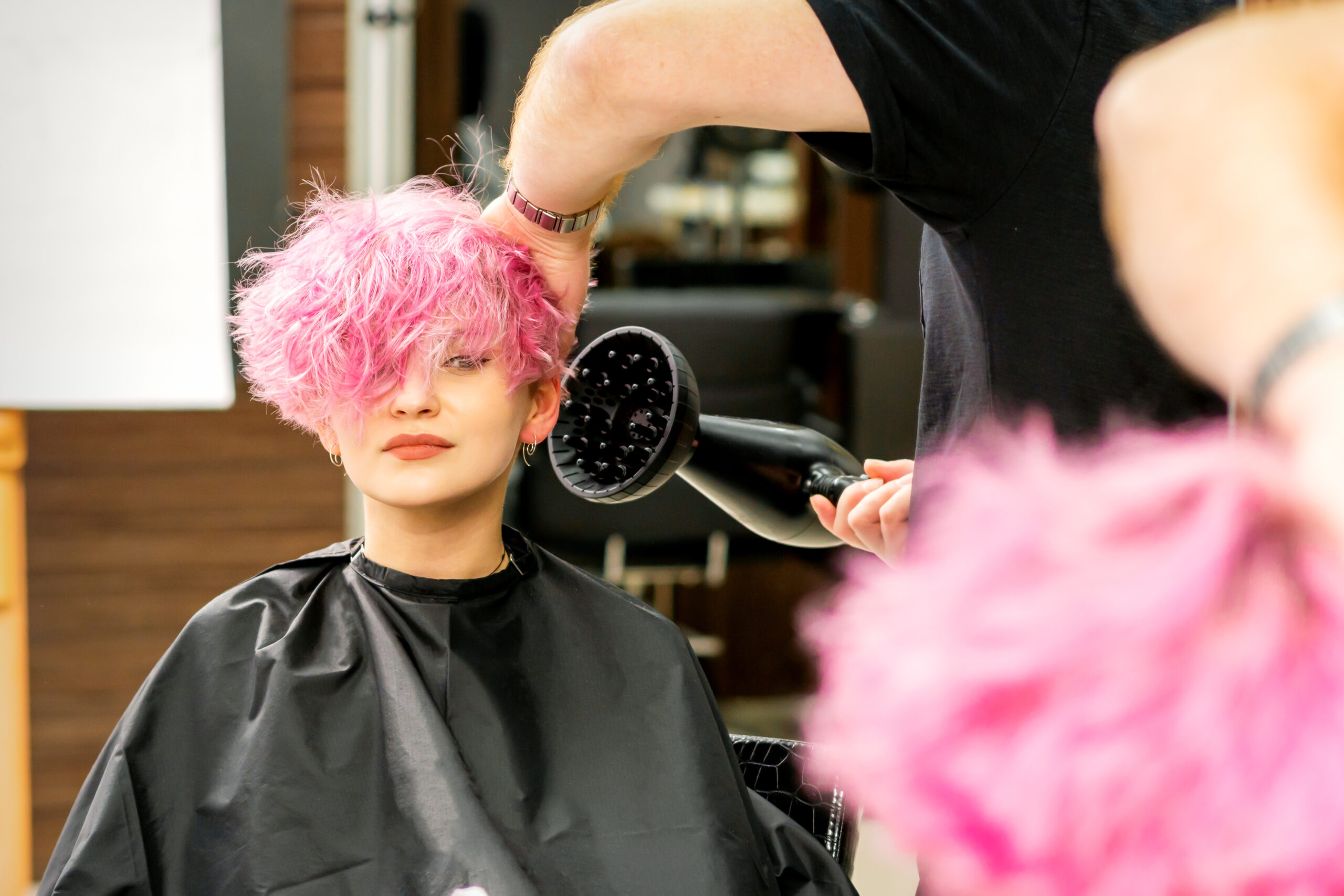 girl in salon with pink hair